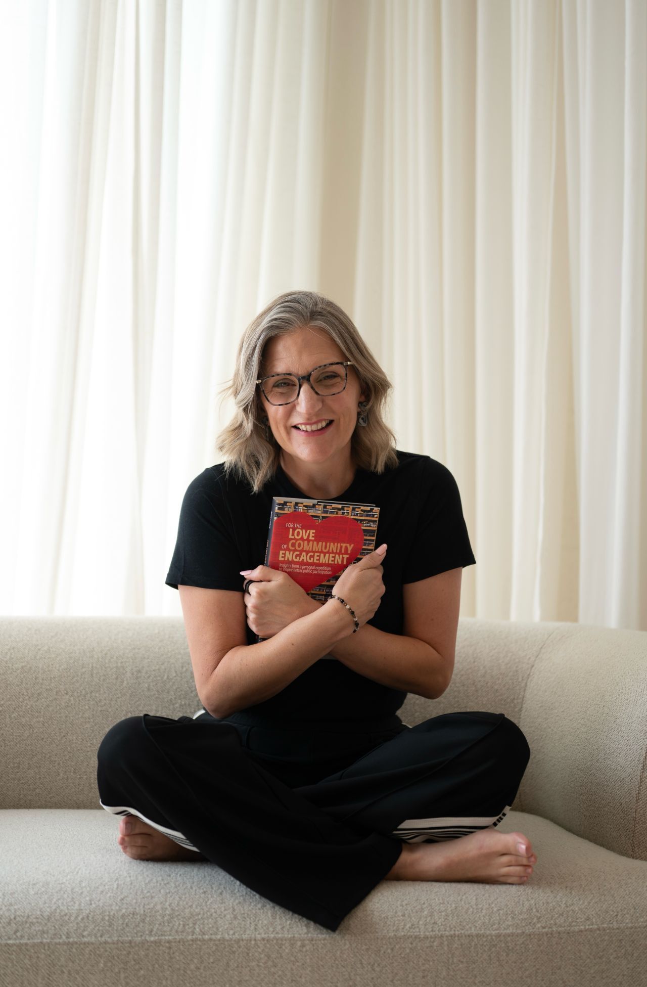 Becky Hirst holding her book